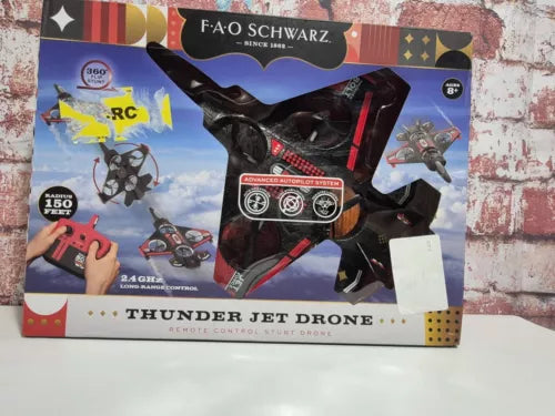 Remote control drone toy in retail box with black drone and red accents