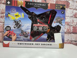 Remote control drone toy in retail box with black drone and red accents
