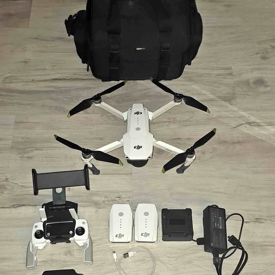 Dji Mavic Pro drone with foldable prop arms, shown with remote and batteries