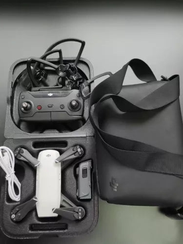 DJI Spark portable mini drone in case, alpine white drone and controller