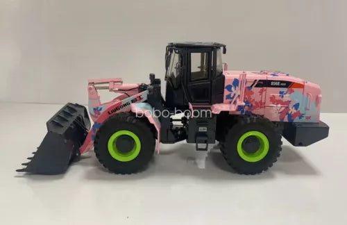 Diecast wheel loader model with front bucket and red-blue cab details