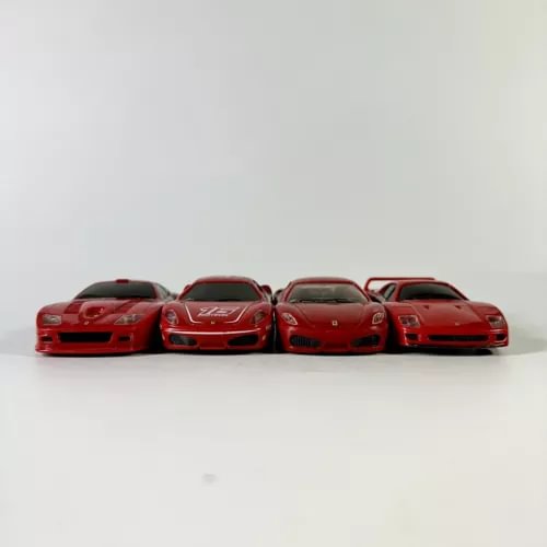 Red Ferrari diecast model car set with 4 cars, front view