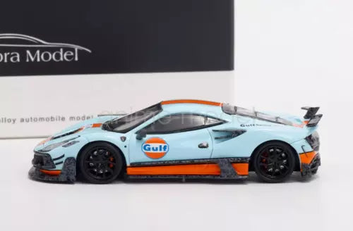 Blue sports diecast car model with black wheels and orange front splitter detail