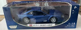 Blue 1:18 scale diecast car model in box, Saleen SR with Motor Max branding