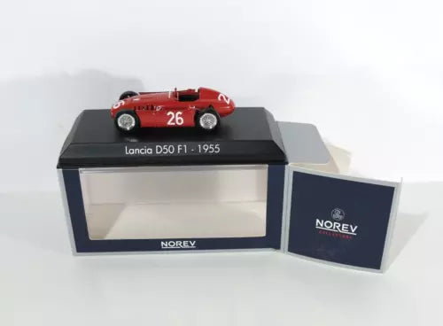 Red Lancia D50 F1 diecast racing car model with number 26 on display stand