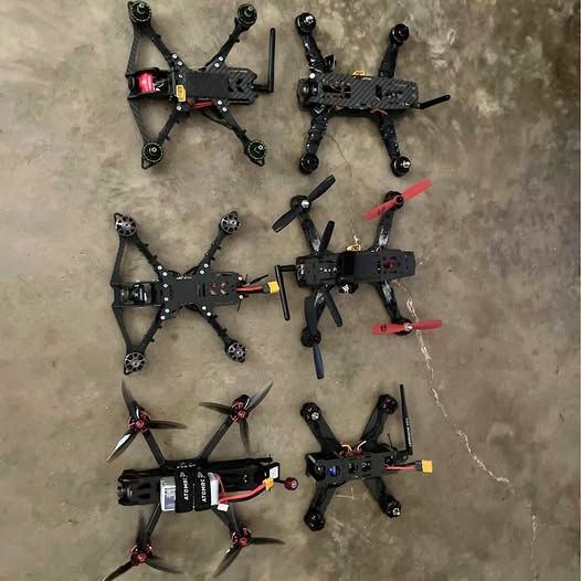 FPV racing quadcopter drone parts lot with multiple drone frames and motors