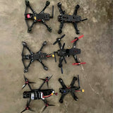 FPV racing quadcopter drone parts lot with multiple drone frames and motors