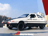 White alloy diecast model car, side view with black wheels and rear spoiler