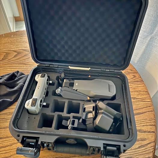 DJI Mavic 3 Classic drone in hard case, propellers and controller ports visible