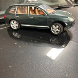 Maisto Porsche Cayenne Turbo 1/18 diecast model, dark green 4-door sedan side view