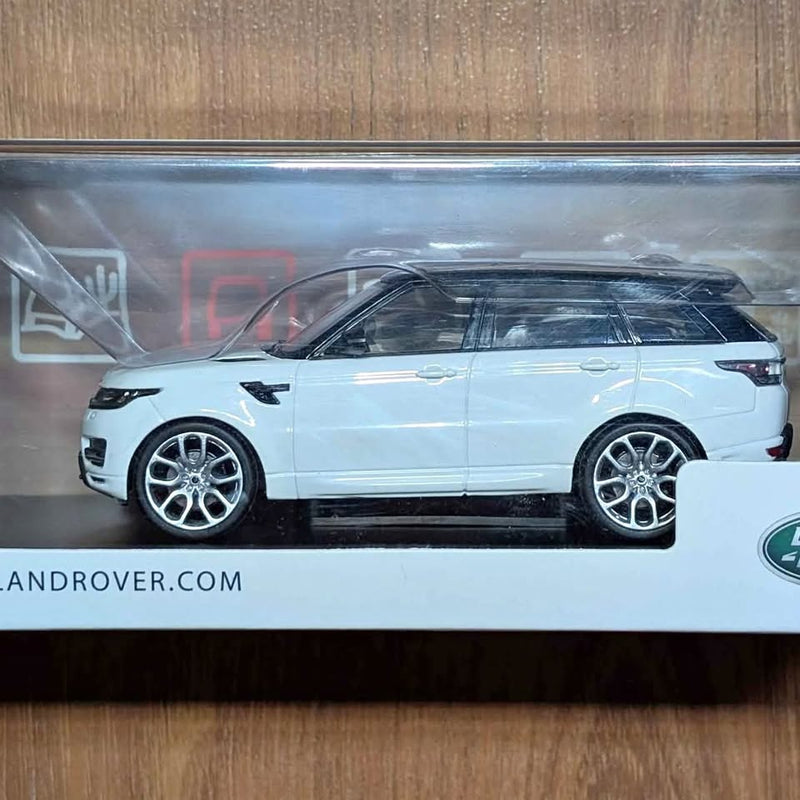 Land Rover Range Rover Sport diecast model car, white SUV side view with silver wheels
