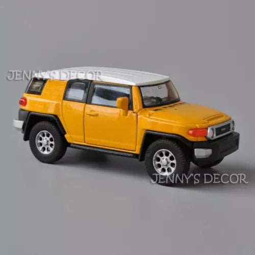 Yellow Toyota FJ Cruiser diecast model car with gray roof, front-side view.