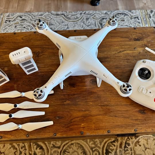 DJI Phantom 2 drone, white quadcopter with four propellers