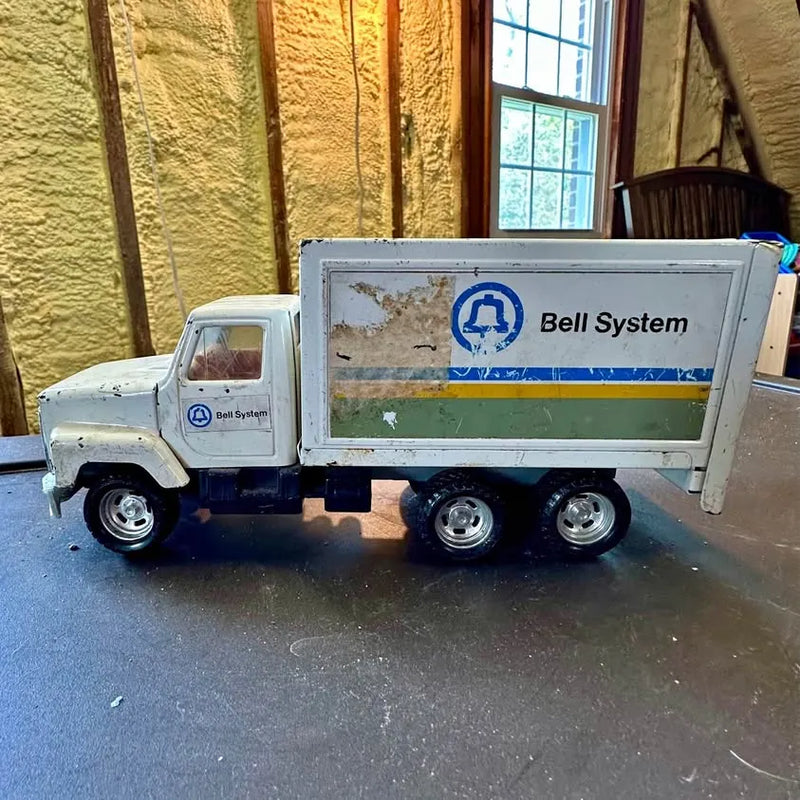 Vintage diecast box truck with Bell System logo, white cab, blue-and-green cargo side