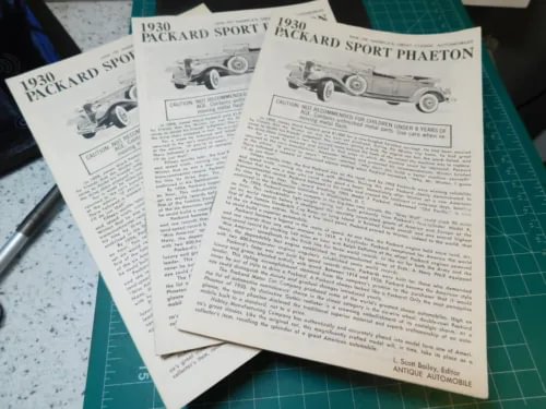 Vintage car brochure pages for a diecast model, text layout and car illustrations