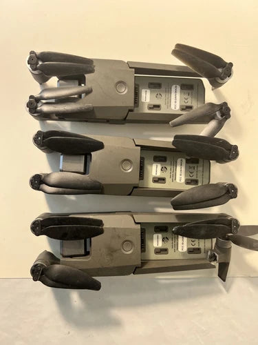 Lot of 3 foldable camera drones, dark gray, with propellers folded in