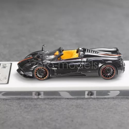 1:64 black convertible sports car model with orange flame accents, detailed wheels