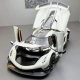 White diecast model car with black front grille and open canopy, 1:24 scale
