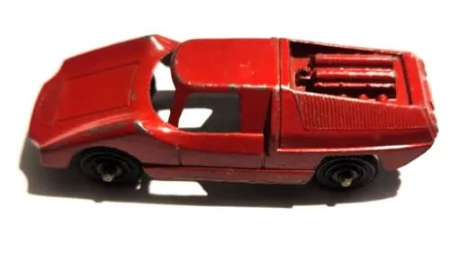 Red diecast toy sports car with black stripe and front grille detail