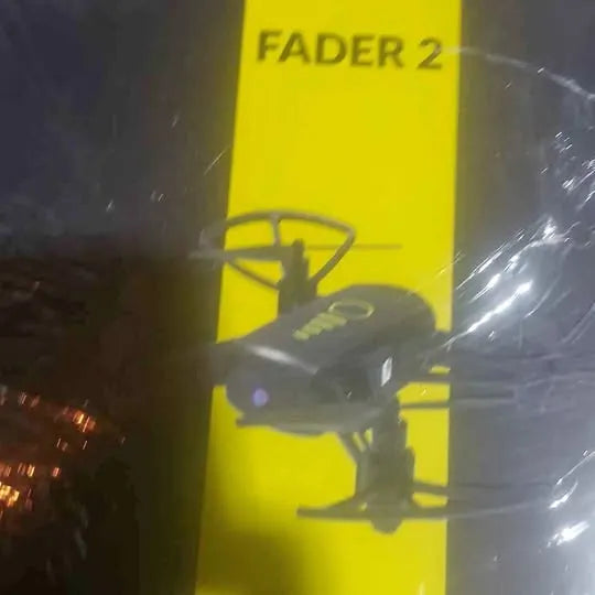 Dark compact drone silhouette with rotor details