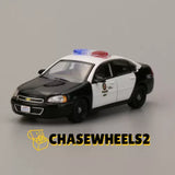 1:64 LAPD police car diecast model, black and white, front three-quarter view