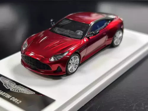 Red 1:64 diecast racing sports car model, front 3/4 view
