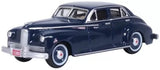 Blue and dark vintage diecast car model, front three-quarter view