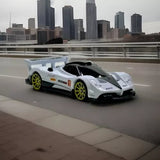 White and black supercar diecast model with yellow wheel rims
