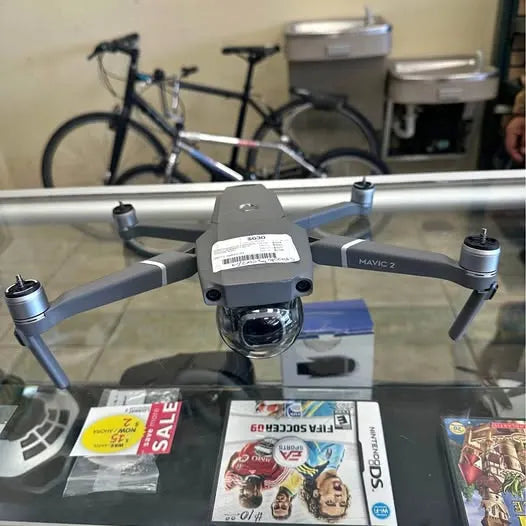 DJI Coupland TX drone with front camera, gray body and visible propellers