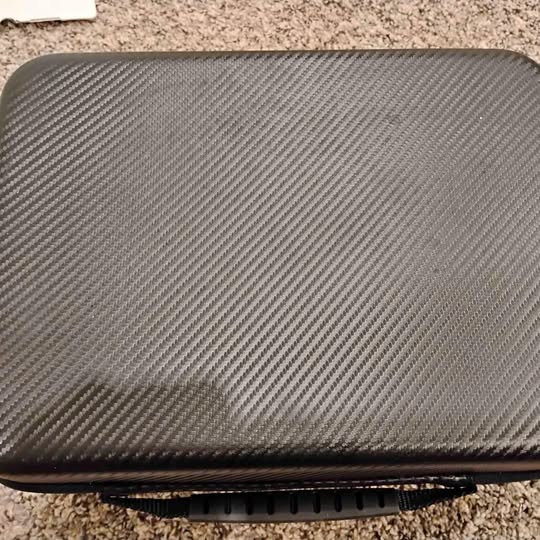 Carbon-fiber style drone case lid with vent slots