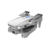 Foldable quadcopter drone with camera, white and gray, front LED and prop guards.