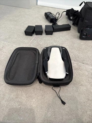DJI Mavic Air drone in black zippered carrying case with charging cable