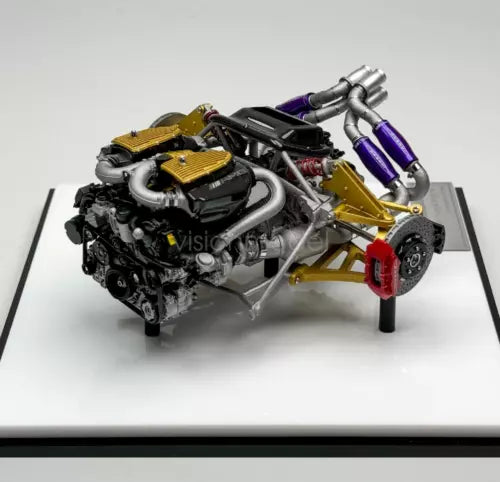 Diecast metal car engine display model with purple exhaust and yellow panels