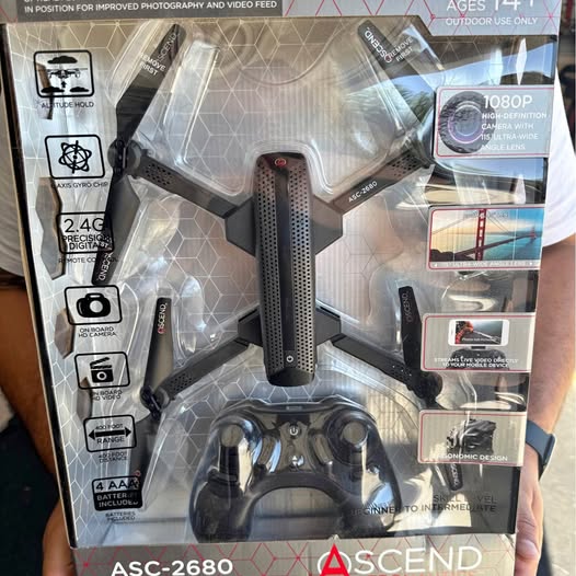 Drone and remote controller in retail box, gray and black