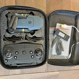 Collapsible drone with controller and propellers in zippered hard case