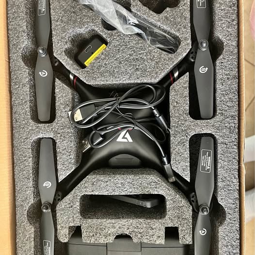 Foldable GPS drone with four arms and propellers, black and gray body