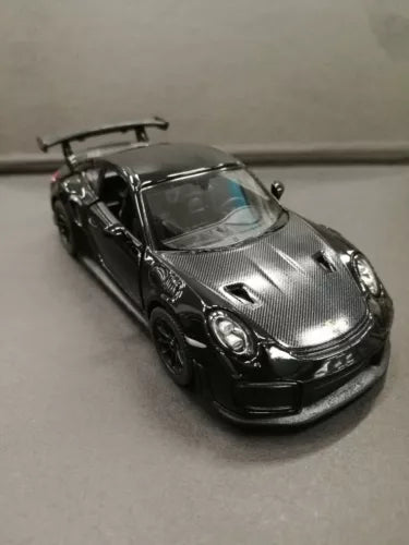 Black 1/36 diecast sports car toy model with front grille and headlights