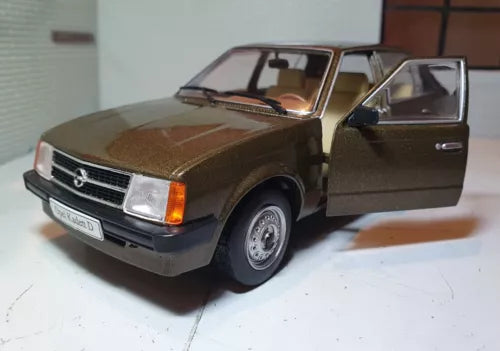 Brown 1979 diecast model car, front-left view, detailed grille and headlights.