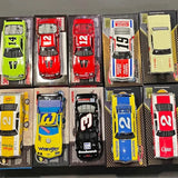 1/24 NASCAR diecast car set in blister packs, yellow red blue and black models