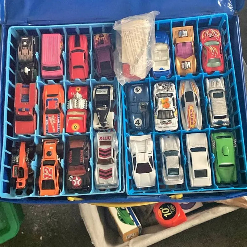 Blue plastic diecast car case filled with assorted toy cars, front row view