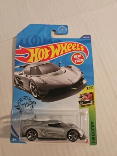Hot Wheels Exotics diecast car in unopened blister pack, gray sports car