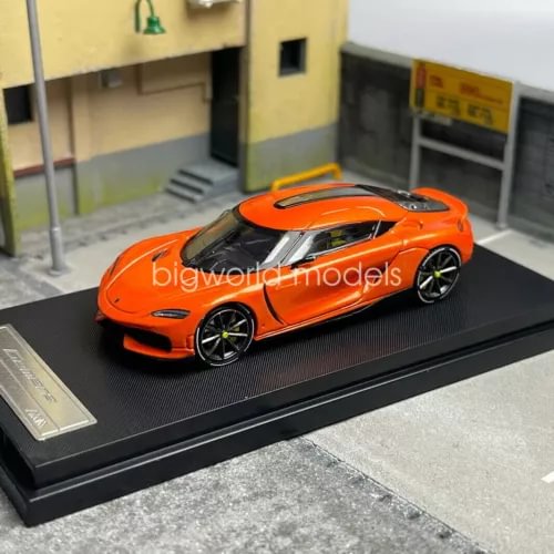 Koenigsegg Gemera 1/64 diecast car model, orange with black wheels, glossy finish
