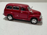 Red diecast 1950 Chevrolet Suburban toy car, 1:36 scale, side view
