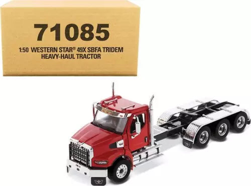 Red diecast heavy-haul tractor truck model with black chassis and front cab.