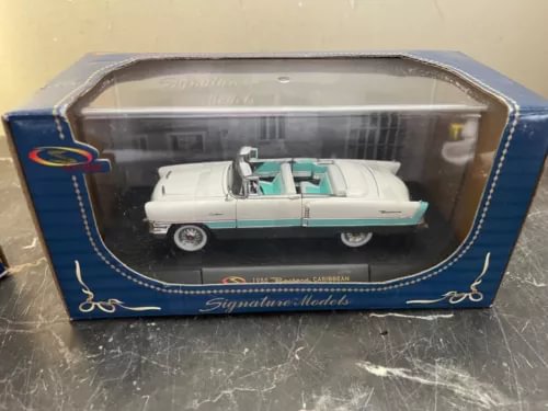 1:32 diecast convertible car model in sealed display box, white with teal accents