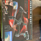 Folding quadcopter drone in retail box, with remote controller and screen