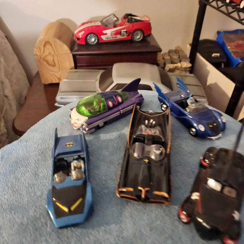 Assorted 1:32 diecast model cars, including purple and blue sports cars