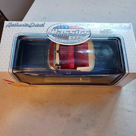 1:18 scale diecast Cadillac D'Iberville MS in retail box, front view through clear window