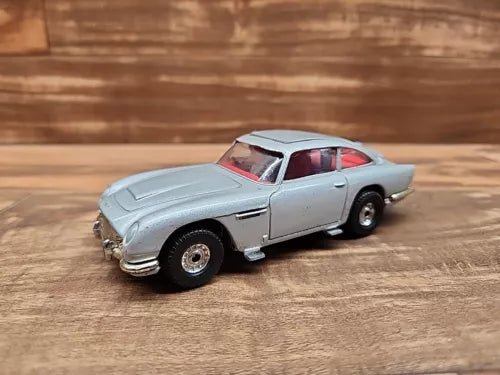 Gray 1/36 scale diecast model car with open hood and detailed front lights