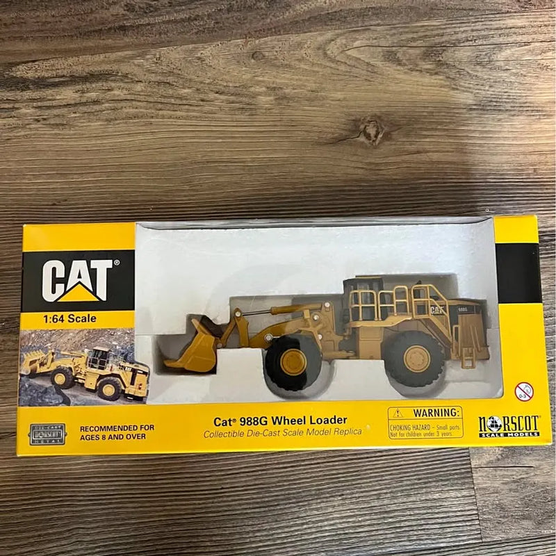 CAT 1:64 Cat 988G wheel loader diecast model in retail box, yellow and brown.